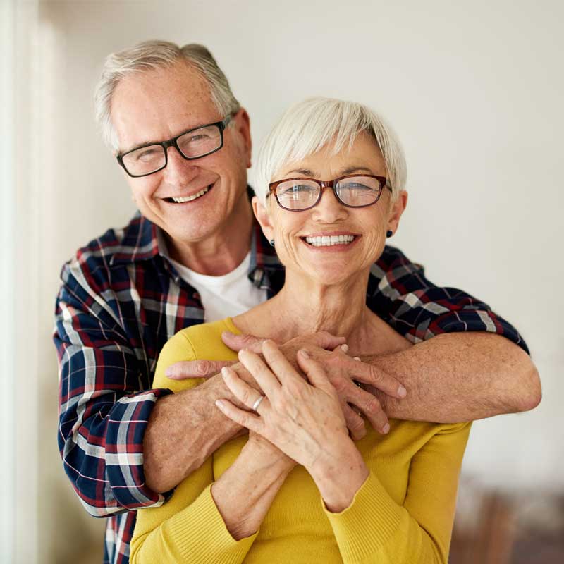 Happy couple looking for a licensed audiologist